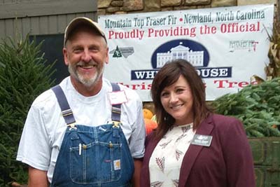 High Country Christmas Tree farmer Larry Smith, Grand Champion of the National Christmas Tree Association’s contest to provide the 2018 Christmas tree to the White House poses with NC Christmas Tree Assoc. Ex. Dir. Jennifer Greene.