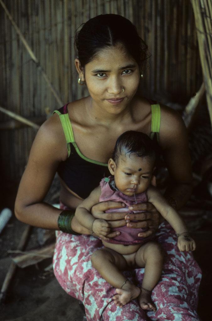 <img typeof="foaf:Image" src="http://statelibrarync.org/learnnc/sites/default/files/images/nepal_048.jpg" width="675" height="1024" alt="Nepalese woman with her child " title="Nepalese woman with her child " />