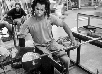 An instructor demonstrates glassblowing techniques at Penland School, ca. 1995. Photograph by Robin Dreyer.