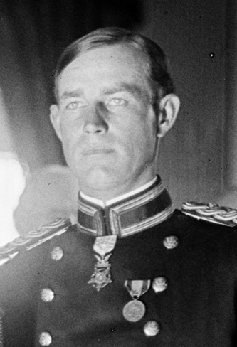 Harris & Ewing. "Medal Of Honor Officers. Gen. Charles F. Humphrey; Gen. John M. Wilson; Col. Charles H. Heyl; Gen. Theodore Schwan; Col. Frederick Fuger; Gen. W.H. Carter; Gen. A.L. Mills; Lt. Gordon Johnston. Picture taken in east room of White House, probably on November 7,  1910 when medal presented to Lt. Johnston for Act of Valor in 1906". Photograph. 1910 November 7. LC-H261- 1861. Prints and Photographs Division, Library of Congress.