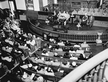 Photograph of Dr. Asa T. Spaulding addressing meeting of St. Joseph's AME Church, Durham, NC on Brown v. Board of Education, May 23, 1954.  Item N_99_3_34, General Negative Collection, State Archives of North Carolina.       